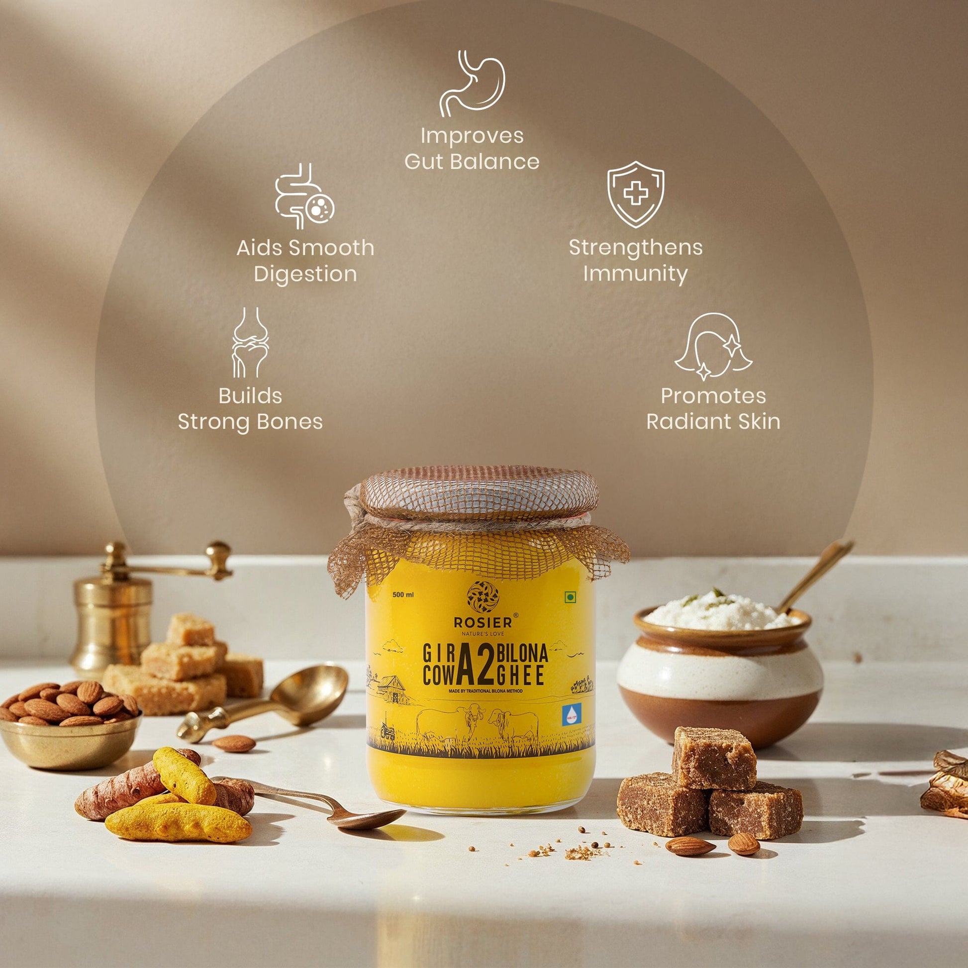 Ashoka Organics Gir Cow A2 Bilona Ghee displayed with traditional ingredients and icons highlighting digestion support, gut balance, immunity, bone health and radiant skin